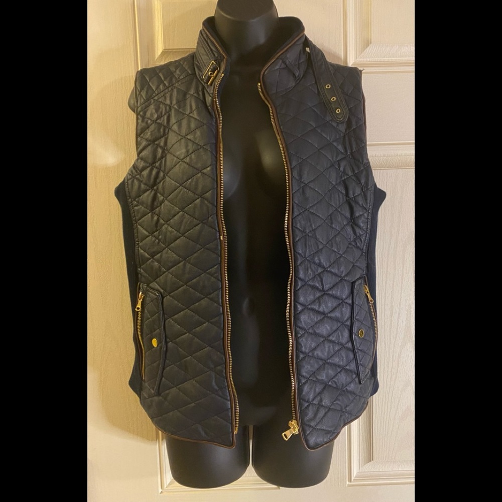 Used navy blue w/brown trim leather vest